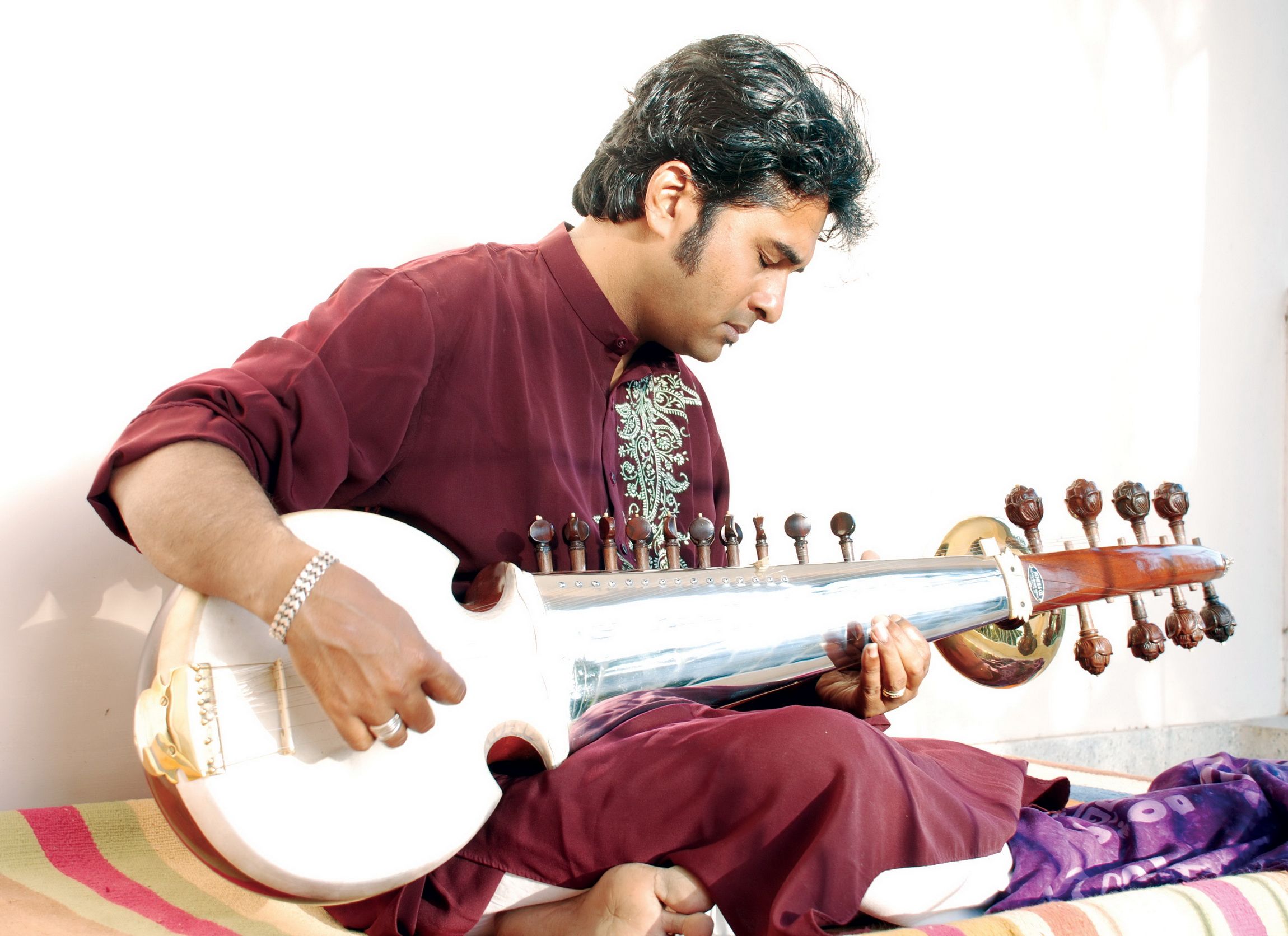 Sarod musician performing Indian classical music