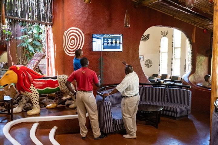 In the front lobby of the Amboseli Serena Safari Lodge, guests can view statistics about the Lodge’s generation and use of solar power. The Lodge’s engineer trains staff on these statistics so that they can answer any questions from guests. AKDN / Lucas Cuervo Moura
