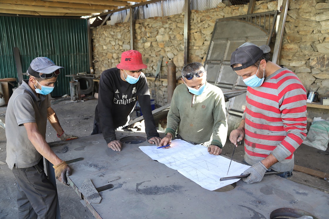 After completing vocational courses and training at UCA, Alijon (far right) began developing his welding shop in Khorog.  He sees opportunities for expanding the business in ways that could help develop the local economy.