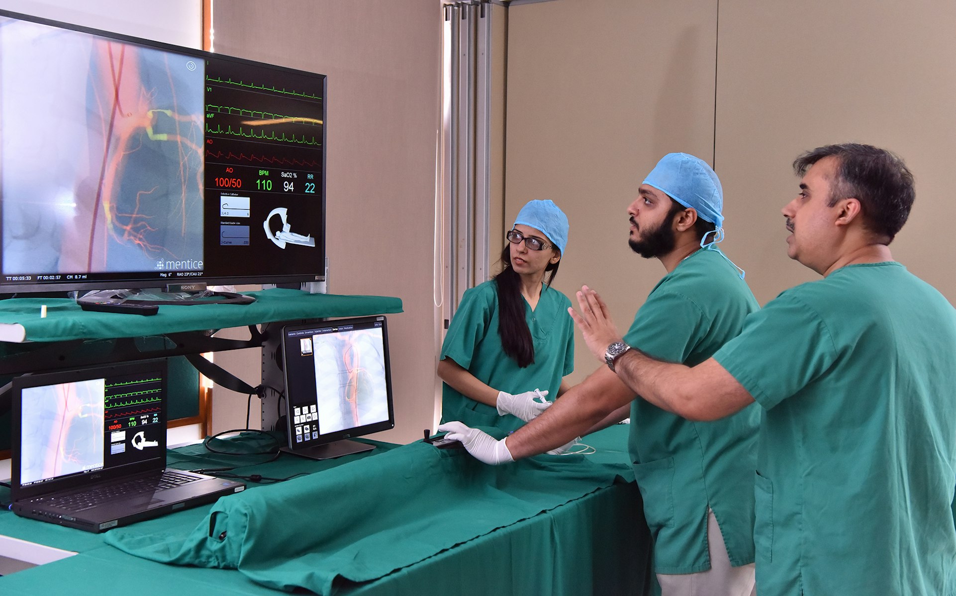 In Karachi, Pakistan, at the Aga Khan University Centre for Innovation in Medical Education, staff work with a cardiovascular simulator in the cath lab.  AKU / Shabbir Hussen