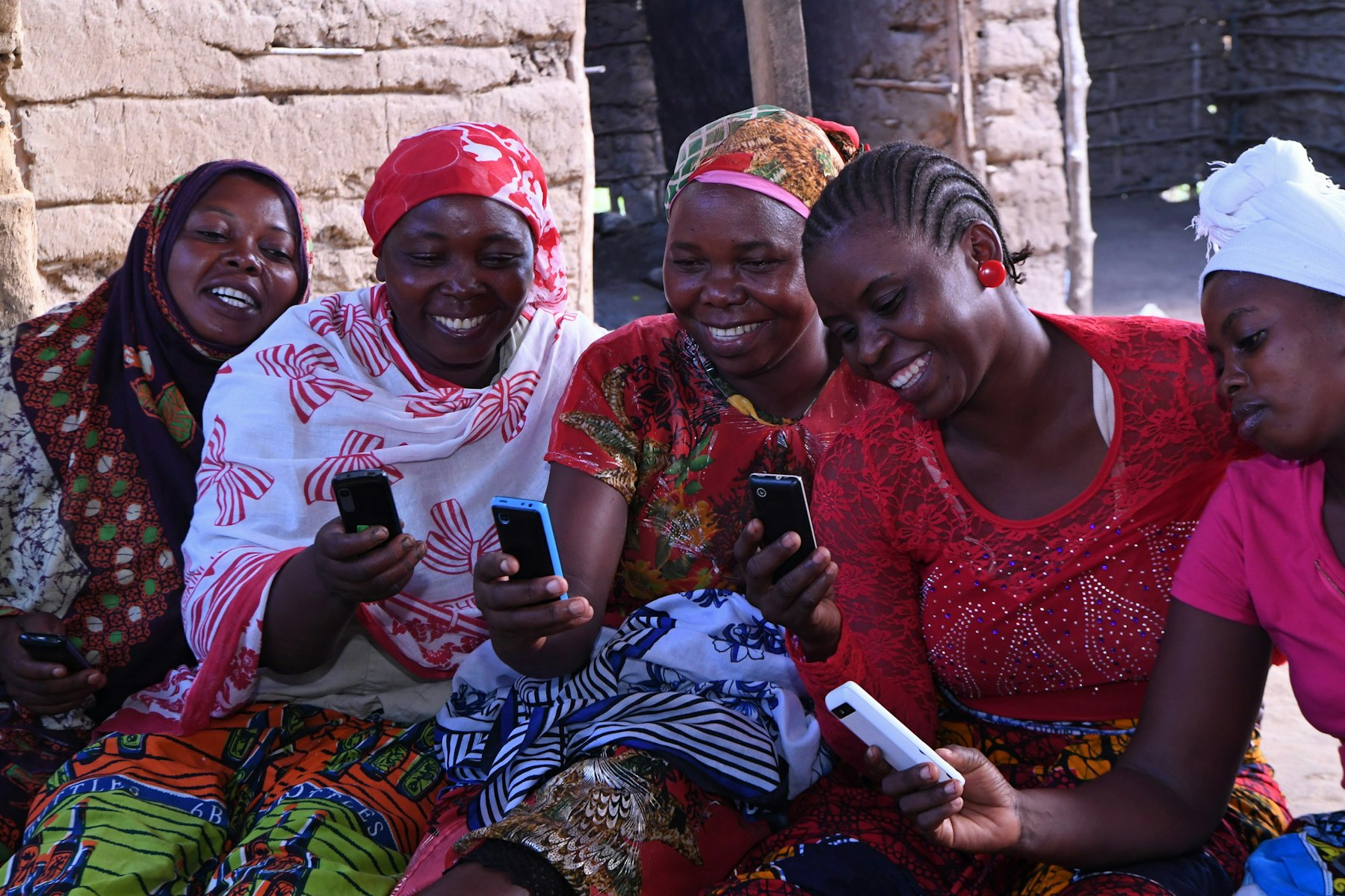 Digital Savings Group (DSG) in Southern Tanzania, supported by the Aga Khan Foundation. DSG members save through their mobile phone wallet accounts. The process is safer than in the traditional community-based savings groups (CBSGs) because they are cashless. AKDN / Zahur Ramji