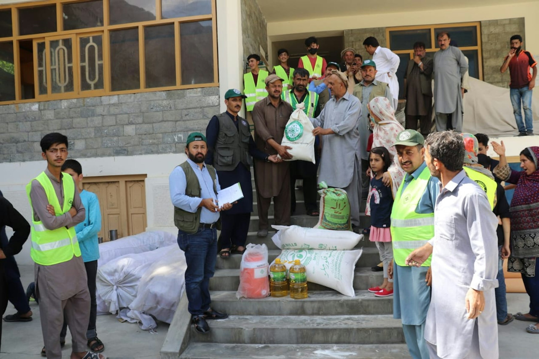 AKAH distributing relief items to flood survivors in Sherqilla