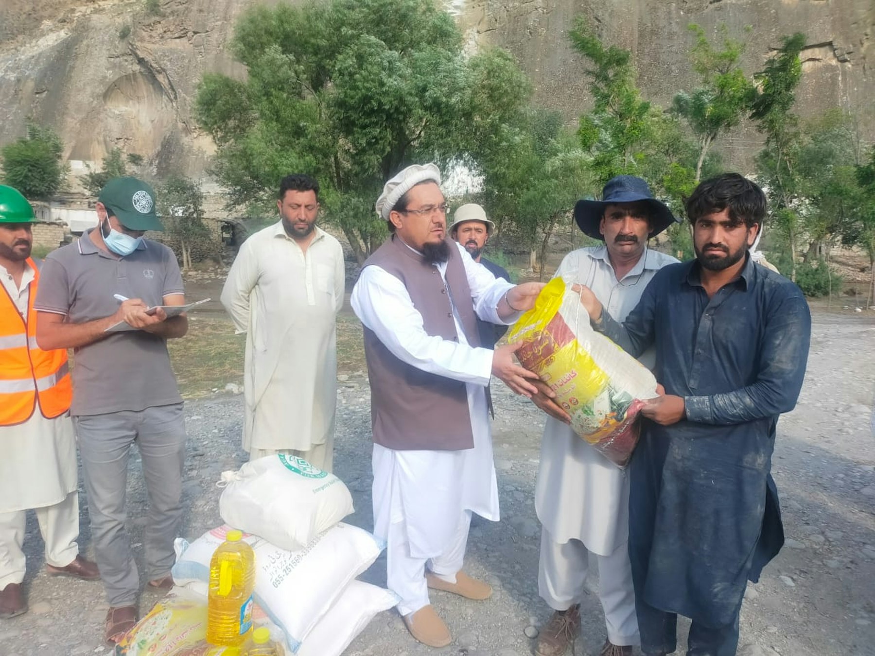 AKAH distributing relief items in Syedabad, Chitral