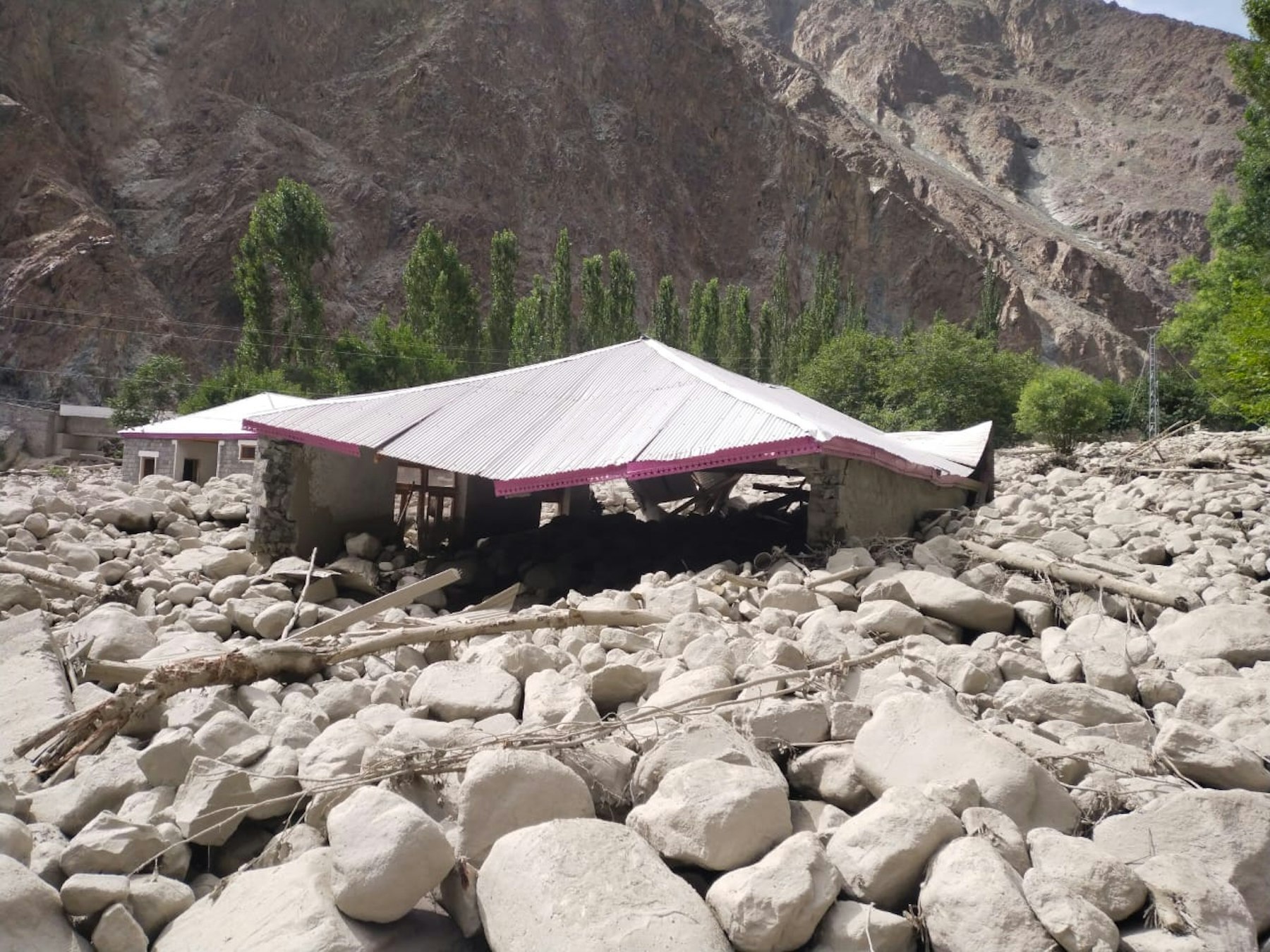 A home destroyed by floods and debris flow in Sherqilla