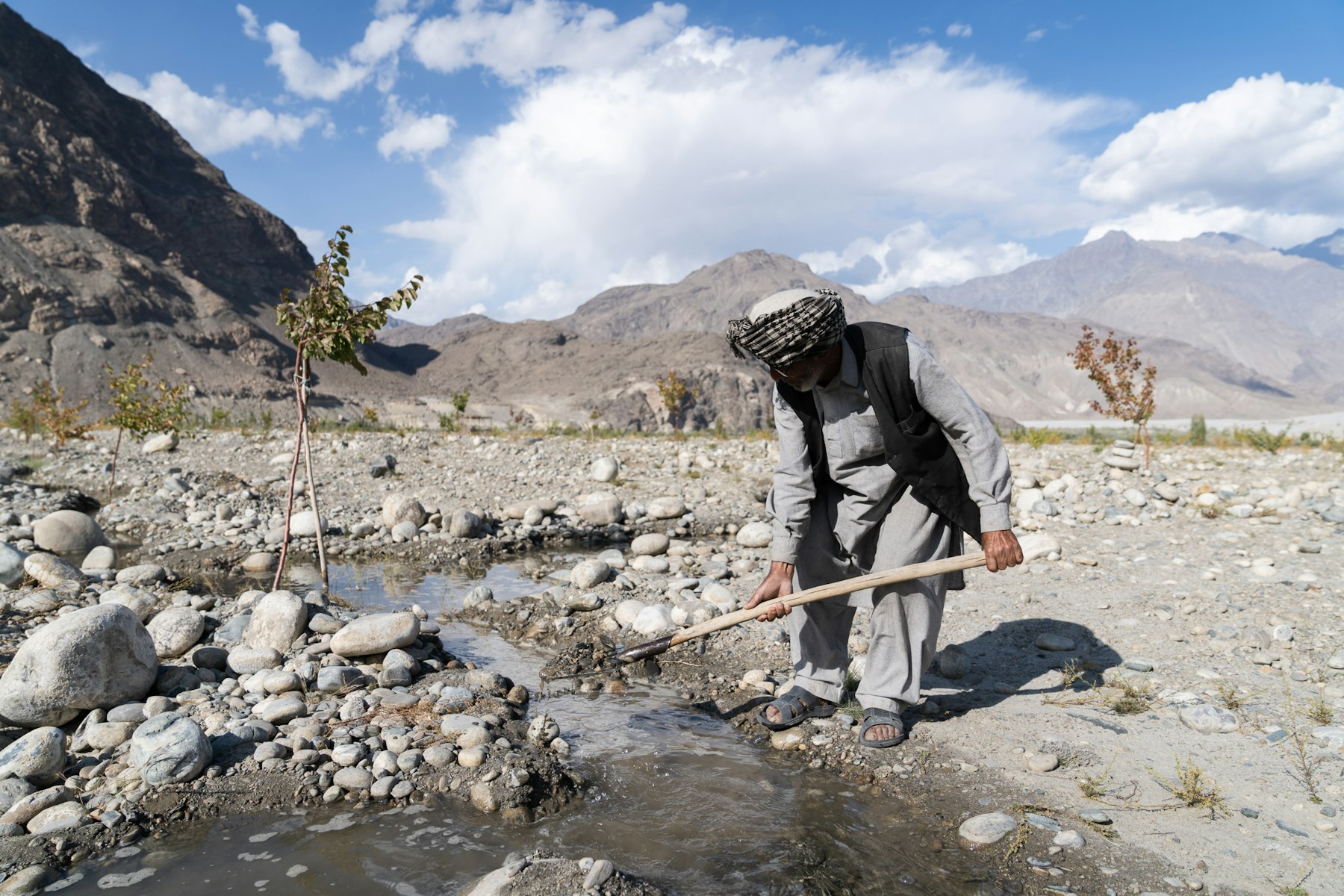 A farmer in Skardu, Pakistan irrigating his land to grow fruit trees. Photo credit: AKF / Christopher Wilton-Steer