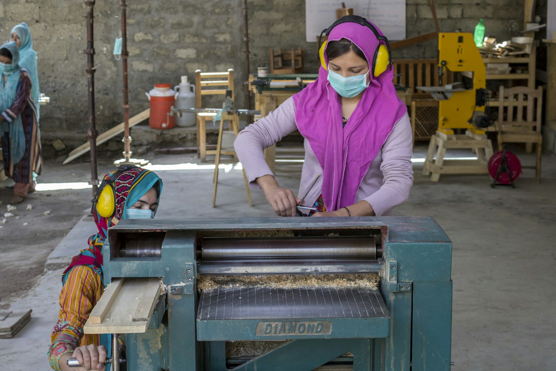 A member of CIQAM, an all-women carpentry business in Pakistan.