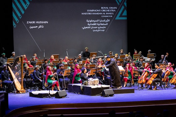 Zakir Hussain, one of the 2022 AKMA Laureates, with Royal Oman Symphony Orchestra and its director Maestro Hamdan Al-Shaely