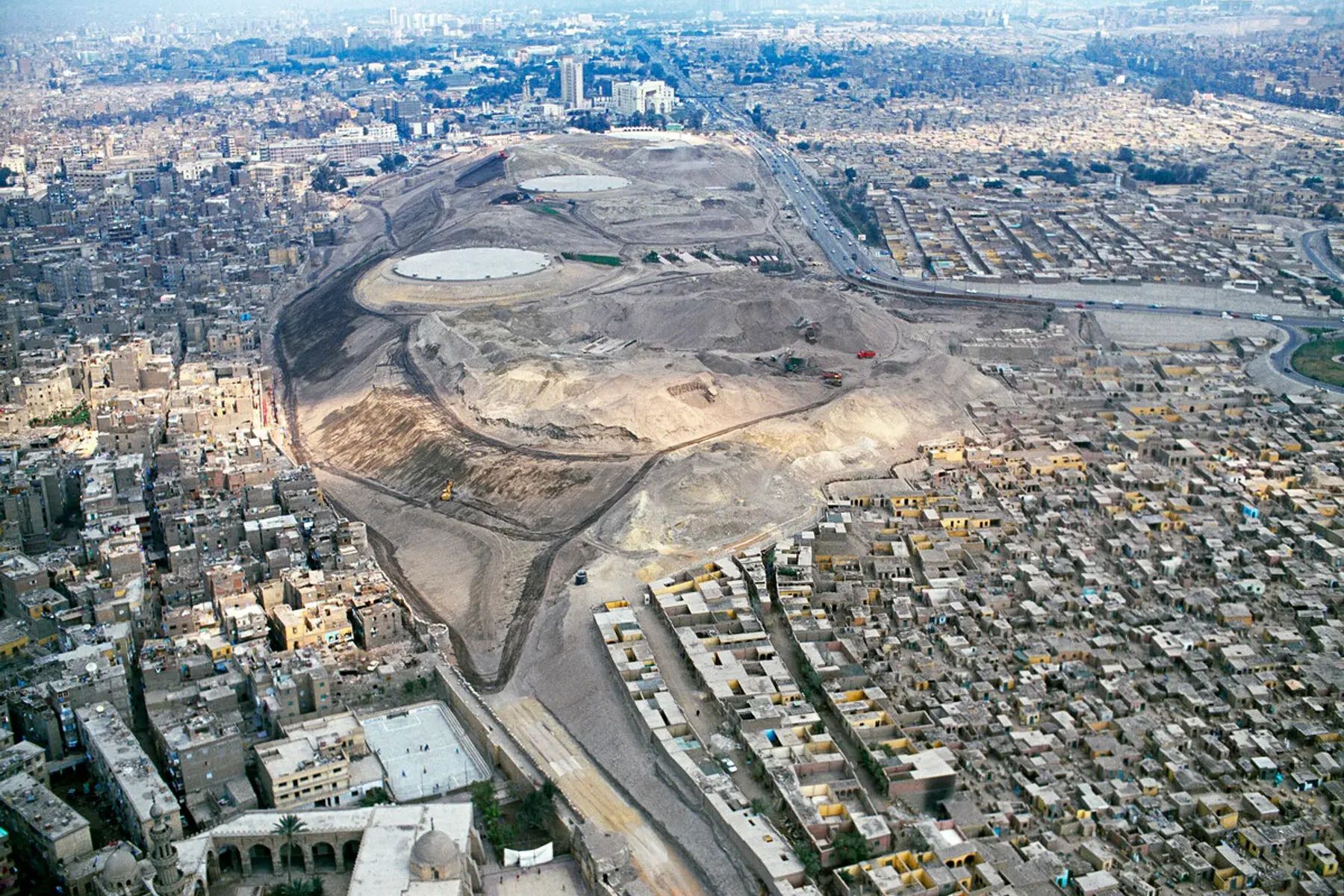 Before: Undeveloped site showing barren land in urban Cairo
